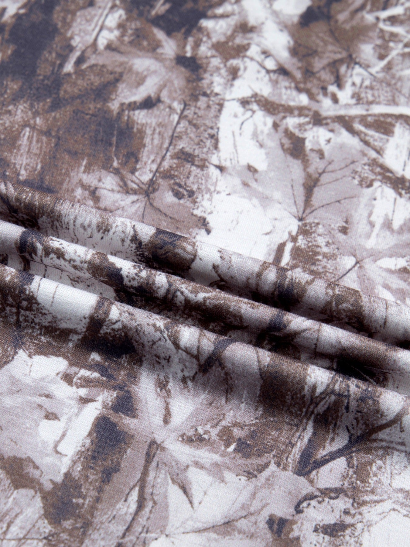 Woodland camouflage tunic with a crew neck and drop shoulder.