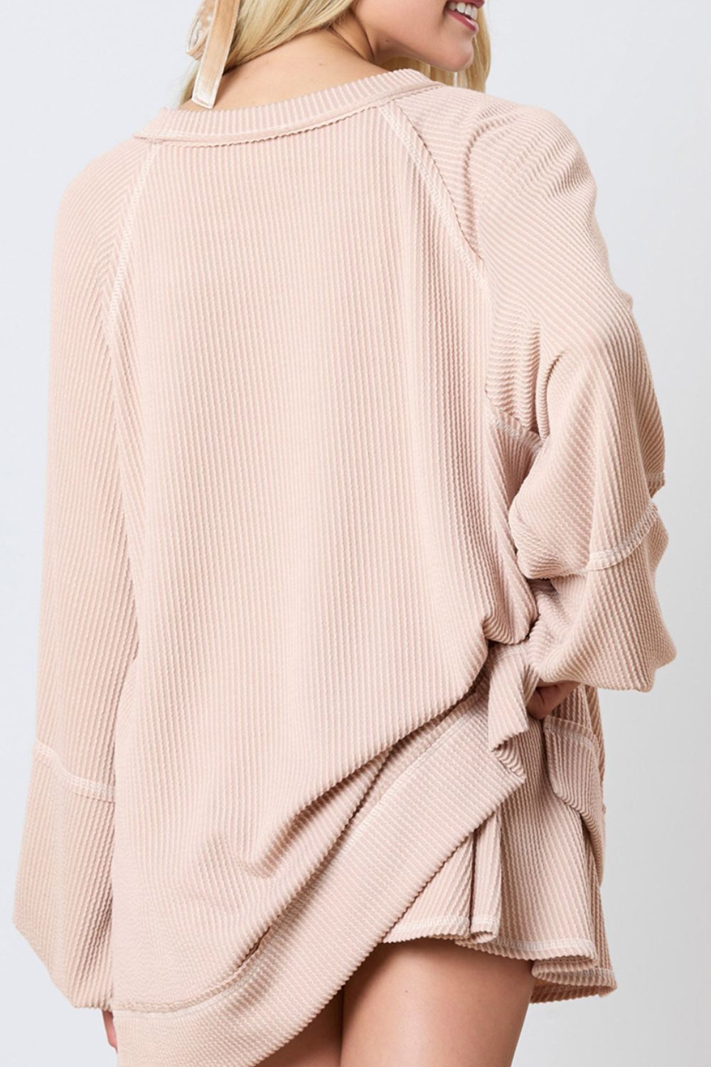 Apricot ribbed loungewear set with raglan sleeves and a relaxed fit.