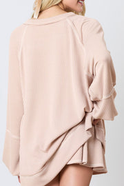 Apricot ribbed loungewear set with raglan sleeves and a relaxed fit.