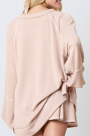 Apricot ribbed loungewear set with raglan sleeves and a relaxed fit.