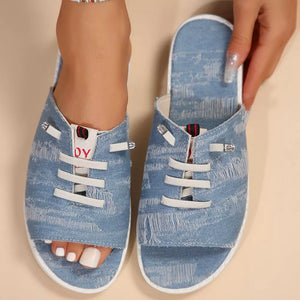 Light blue distressed canvas open-toe platform sandals with white laces and rhinestone details.