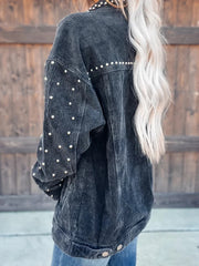Black corduroy jacket with pearl stud details on shoulders and sleeves
