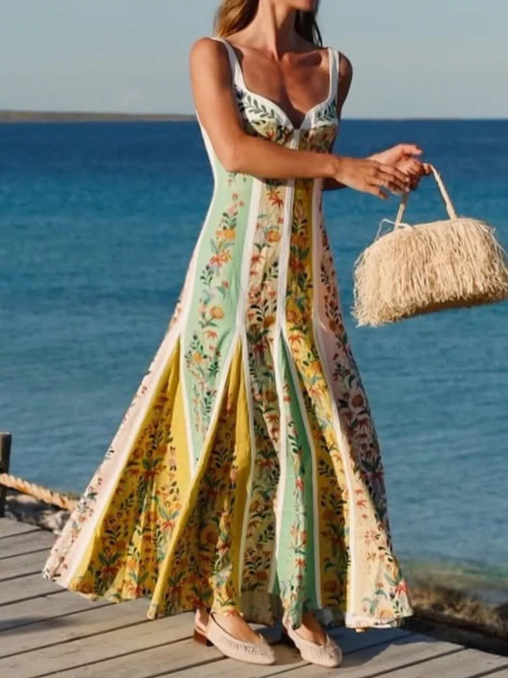 Botanical print sweetheart maxi dress with vertical panels in yellow, green, and pink.