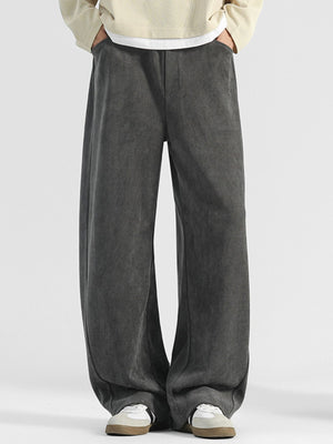Men's dark gray loose fit sweatpants with pockets and a subtle herringbone texture.