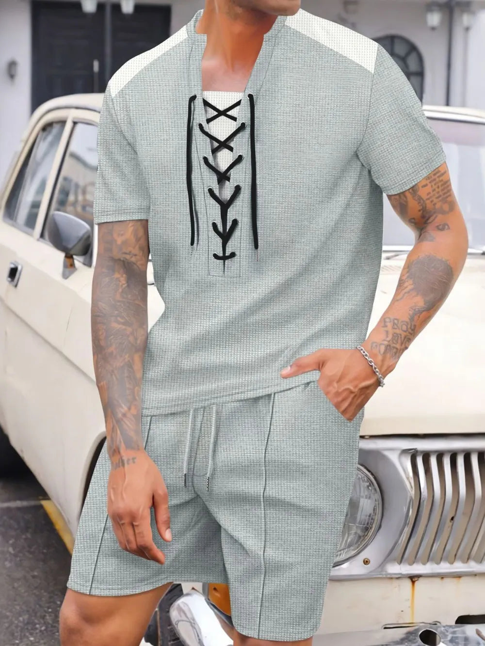 Gray waffle knit lounge set with lace-up neckline and drawstring shorts.