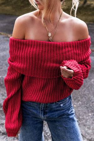 Deep red off-the-shoulder sweater with ribbed knit and wide sleeves.