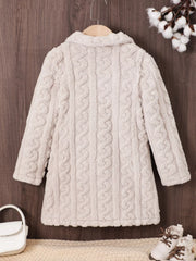 Baby pea coat in eggshell with cable knit texture and plush fabric.