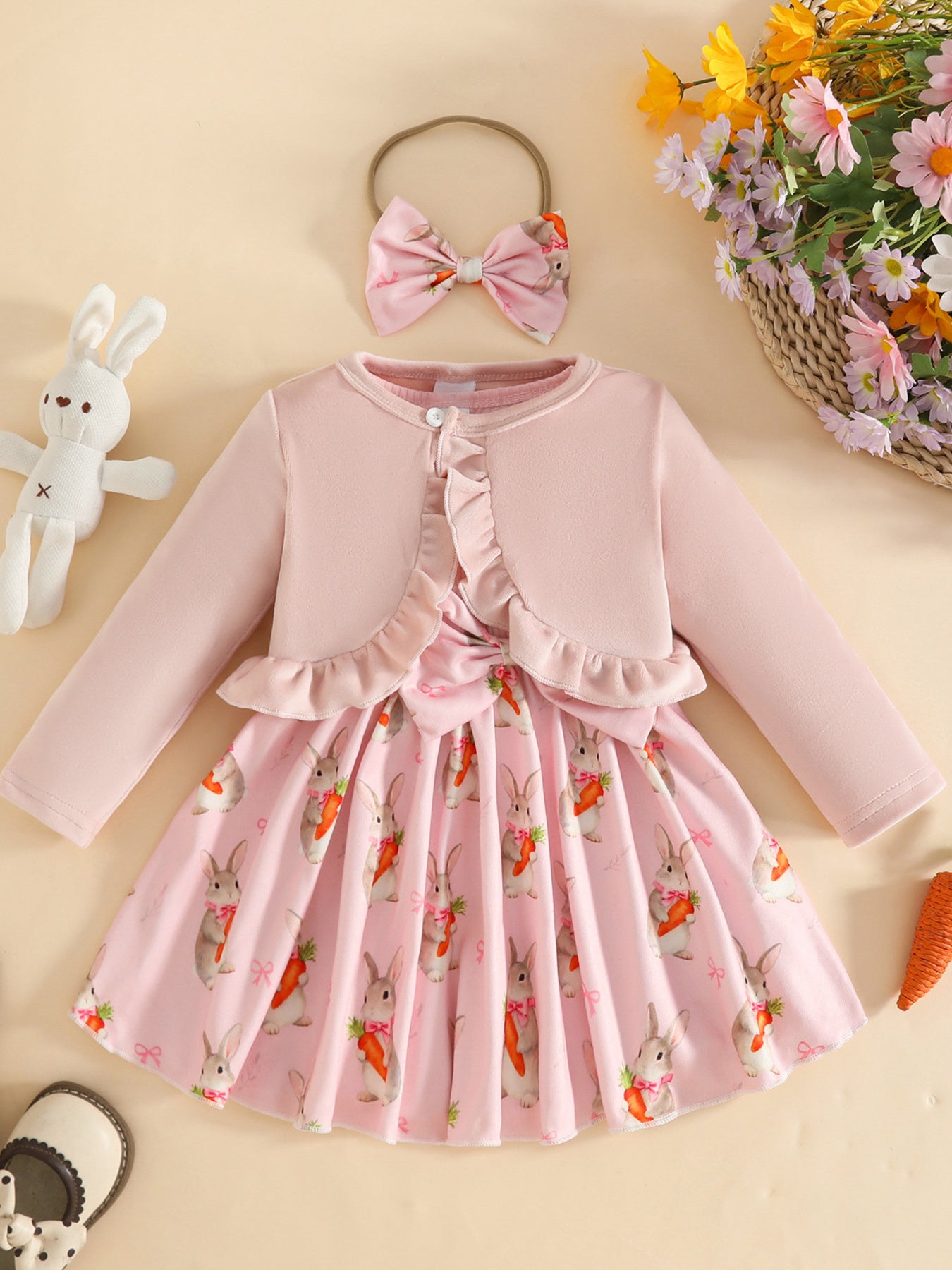 Pink baby set with ruffled cardigan and bunny carrot print dress, includes matching bow headband.