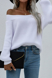 White ribbed knit sweater with off-the-shoulder boatneck and puff sleeves.