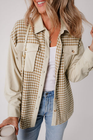 Beige houndstooth corduroy patchwork shacket with button pockets and corduroy sleeves.