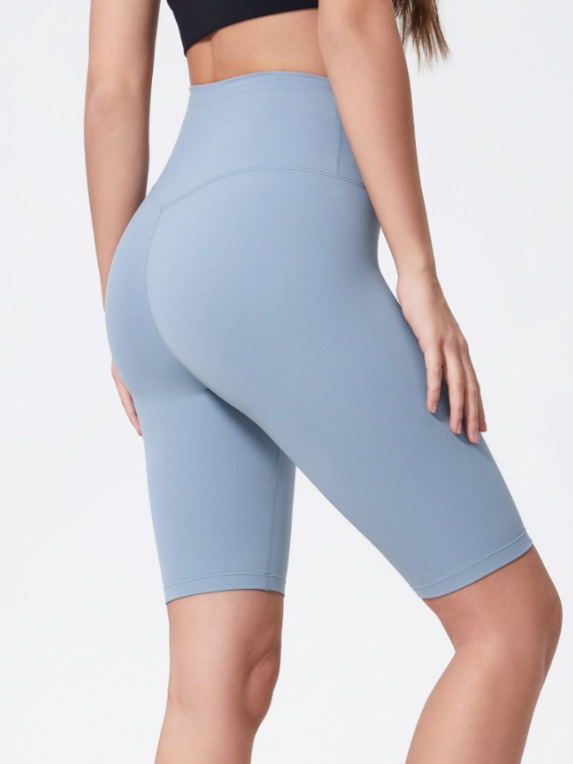 Sculpted Contour Active Cycling Shorts in Light Blue with a high waist and V-seam detail.