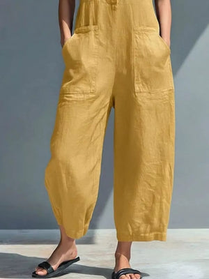 Yellow button-down sleeveless romper with wide legs and front pockets.