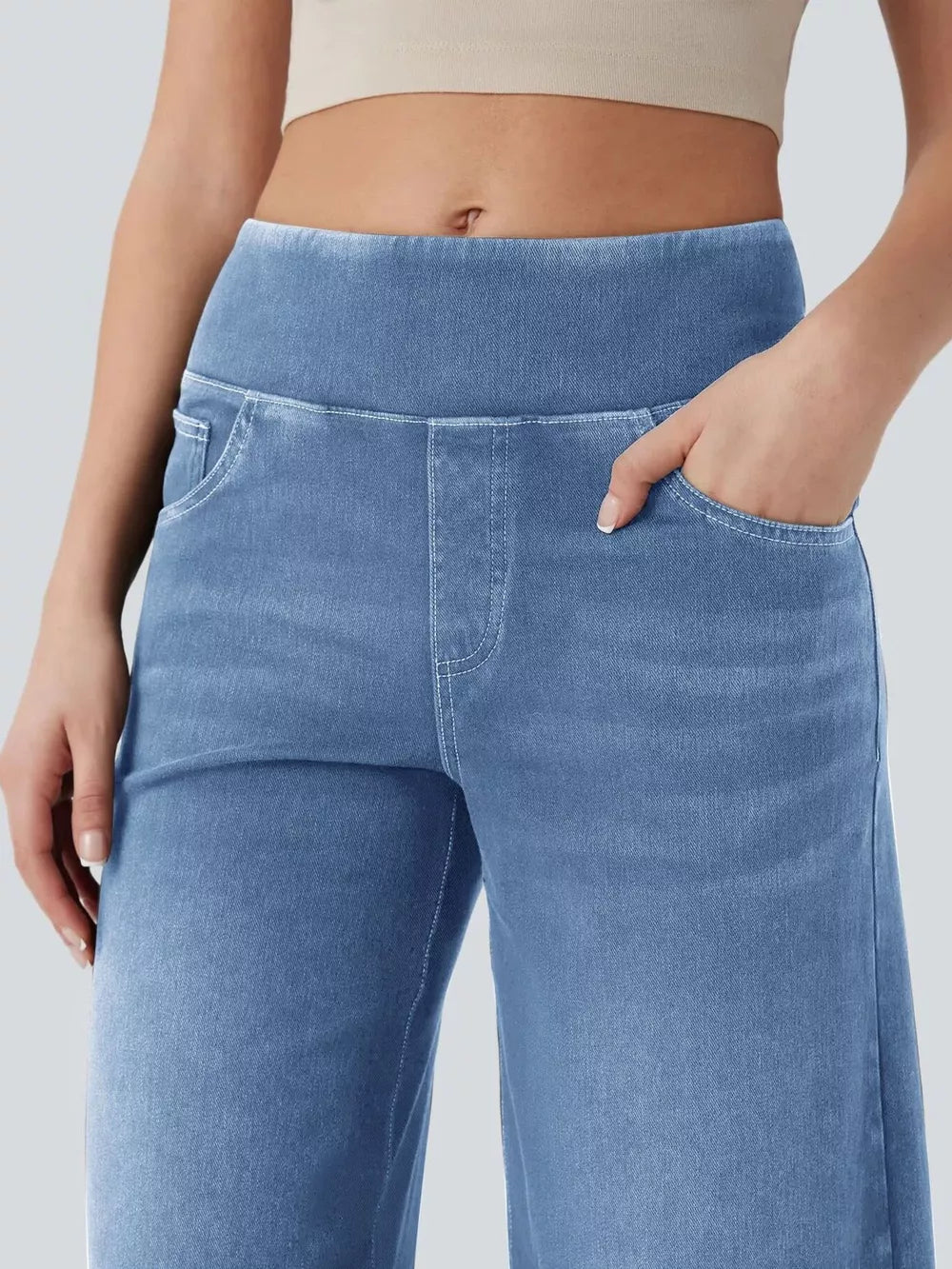 Maternity wide-leg jeans in light blue denim with a comfortable elastic waistband and pockets.