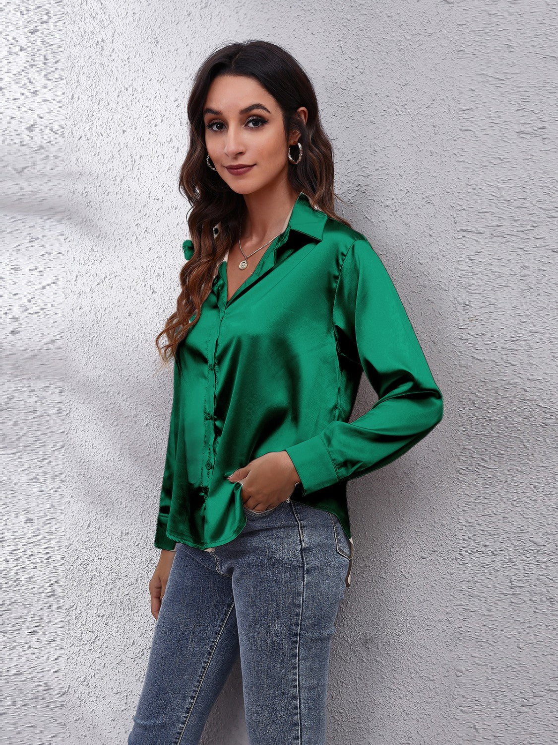 Green satin collared button-down shirt with long sleeves.
