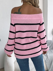 Off-the-shoulder striped knit pullover sweater in blush pink with black stripes.