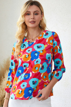 Painterly floral V-neck blouse in polyester with 3/4 sleeves and a vibrant abstract blossom print.