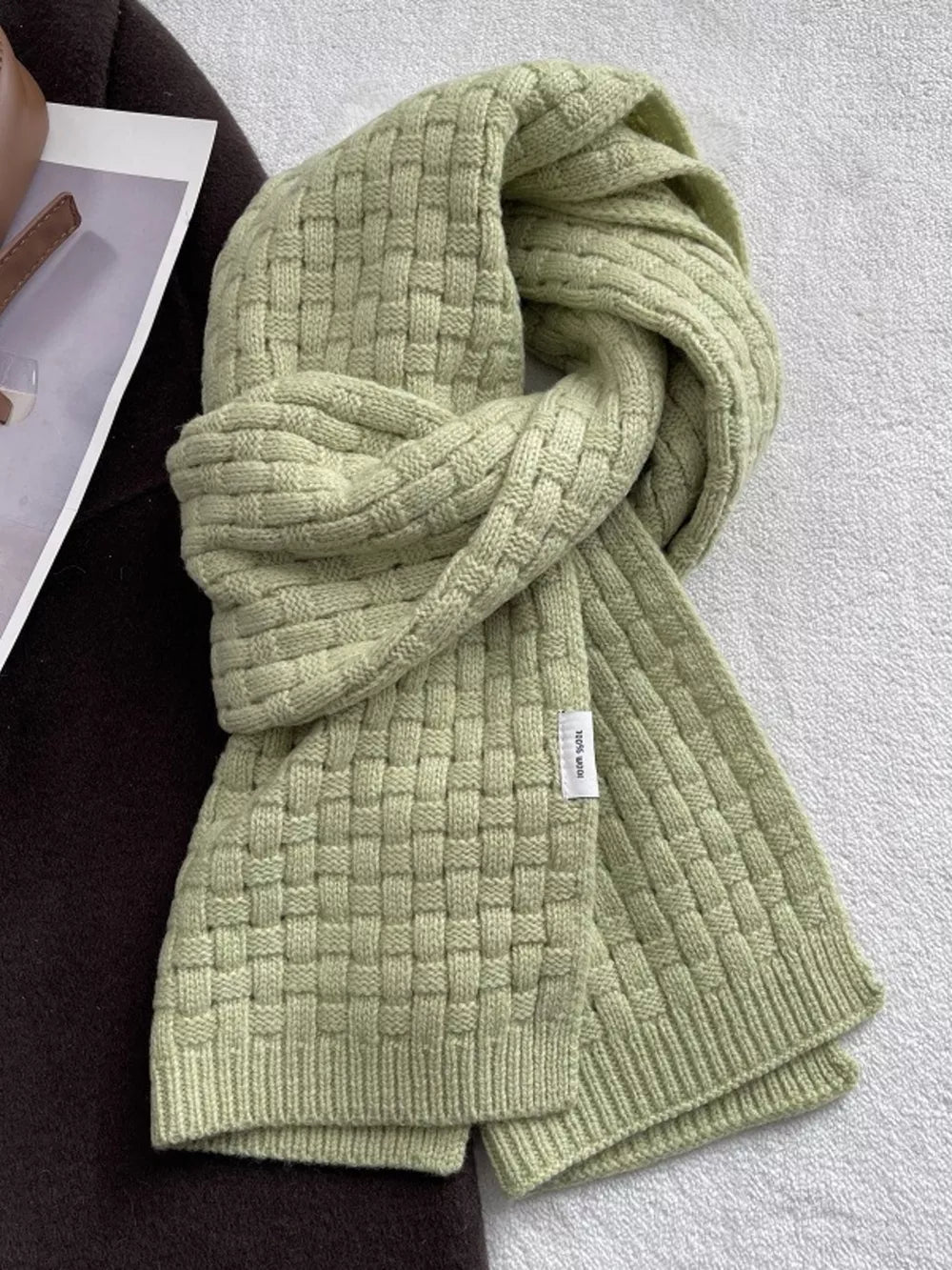 Luxurious dual knit wool scarf in sage green with basketweave pattern.