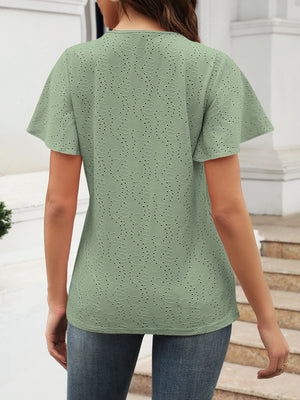 Sage green eyelet blouse with flutter sleeves and V-neck.