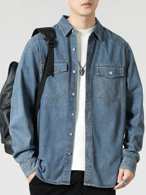 Classic relaxed fit blue denim shirt with button front and chest pockets.
