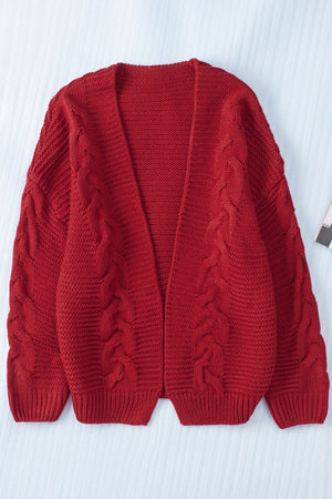 Burgundy cable knit open-front cocoon cardigan with textured sleeves.