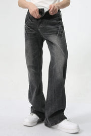 Washed black wide-leg denim jeans with a relaxed fit and subtle whiskering details.