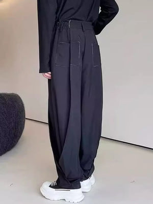 Men's Loose Fit Pants in Black, model styling view