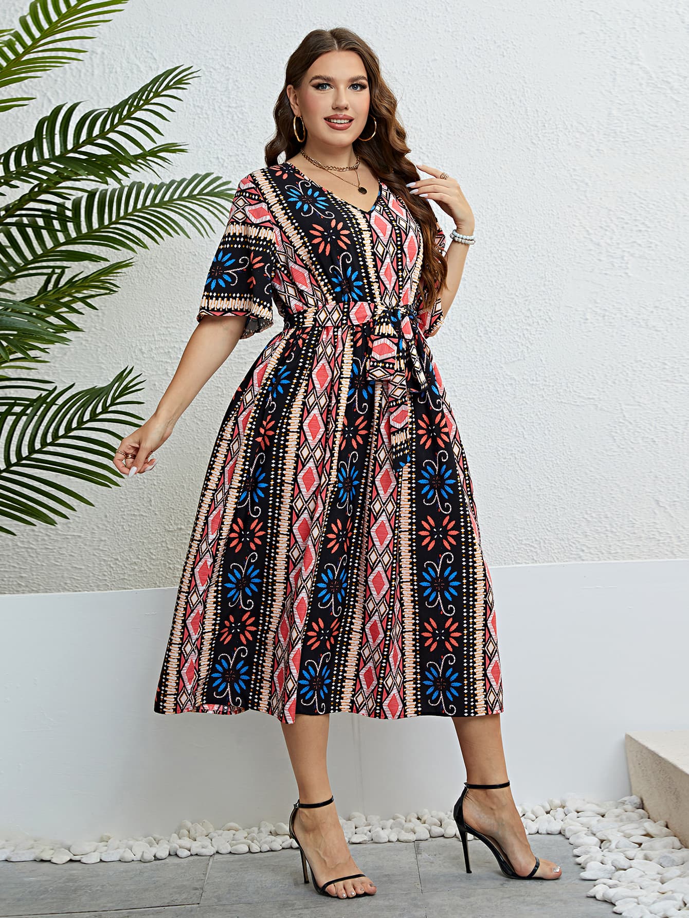 Geometric print midi dress with tie waist, V-neck, short sleeves, and A-line skirt in multicolor.