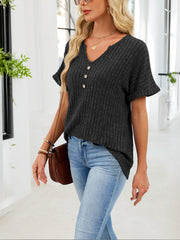 Black ribbed knit short sleeve t-shirt with V-neck and decorative buttons, curved hem.