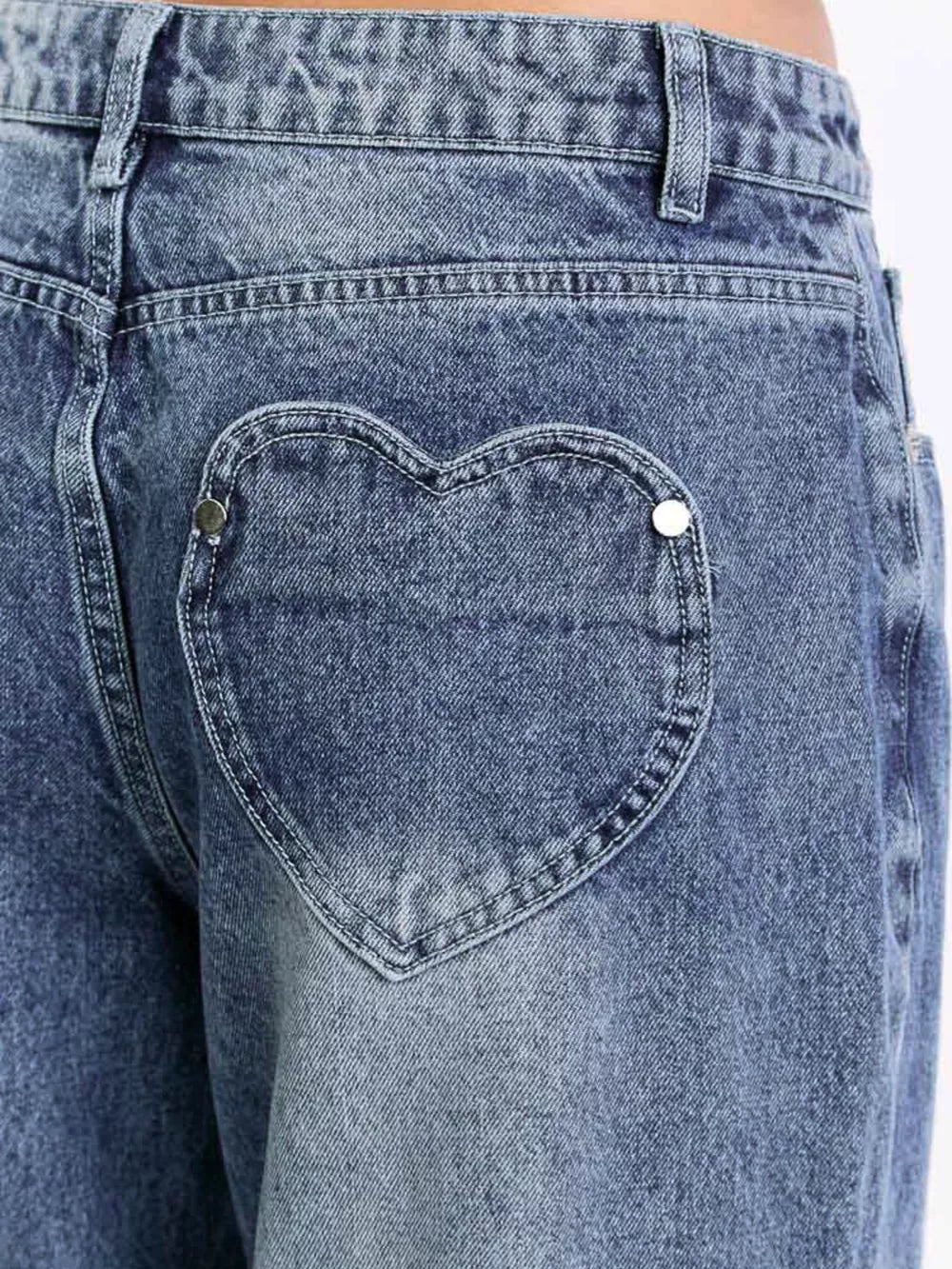 Wide-leg denim jeans in blue with a heart-shaped back pocket detail.