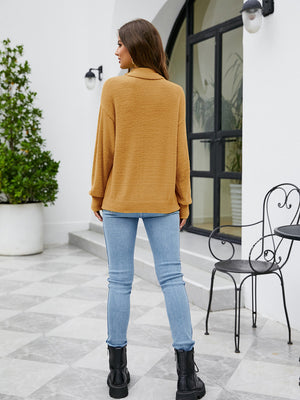 Textured mock neck knit sweater in honey color with long sleeves.