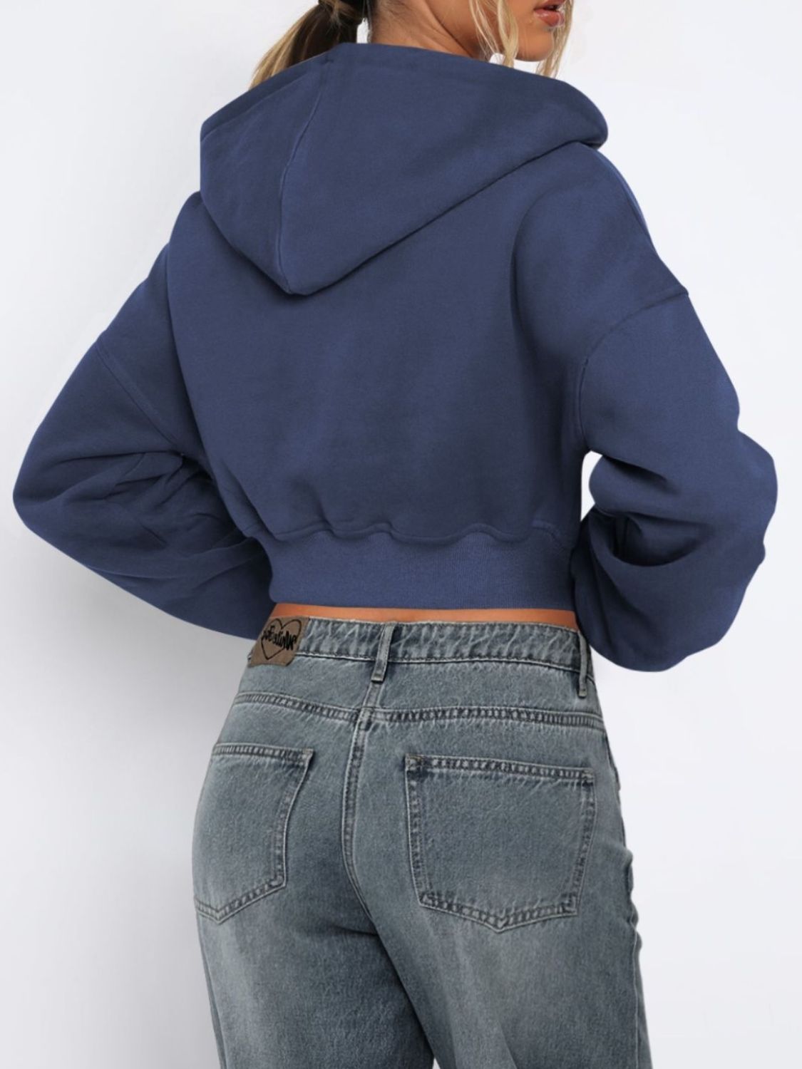 Navy cropped zip-up hoodie with ribbed hem and hood detail.