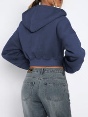Navy cropped zip-up hoodie with ribbed hem and hood detail.