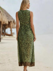Vibrant leopard print midi dress in dark green with a V-neck and sleeveless design.