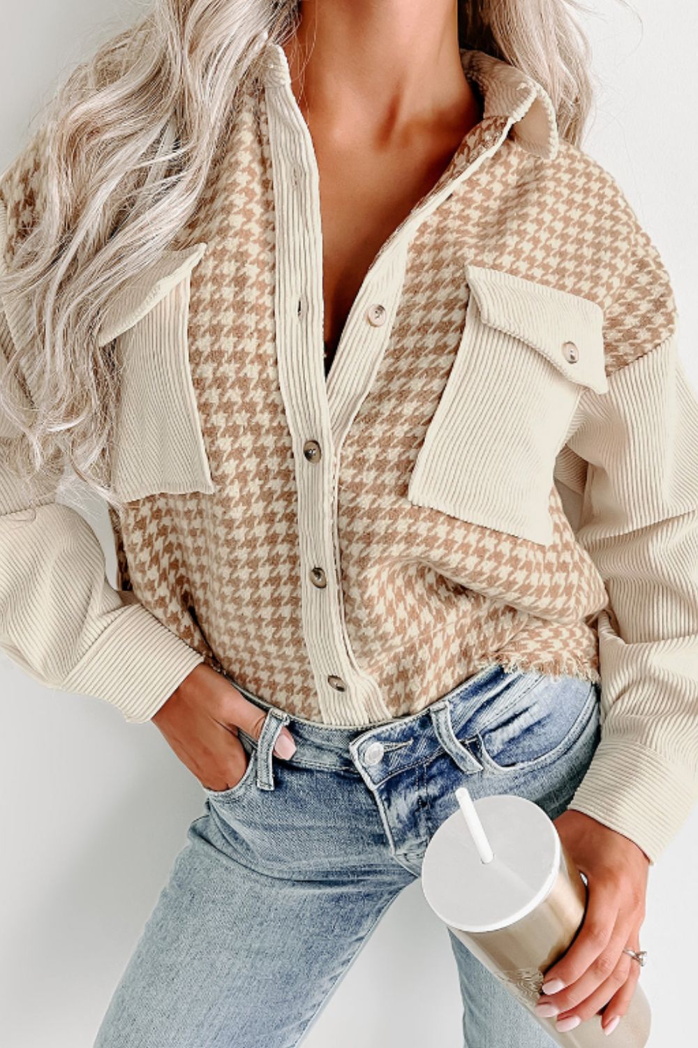 Houndstooth corduroy patchwork shacket in beige with button front and chest pockets.