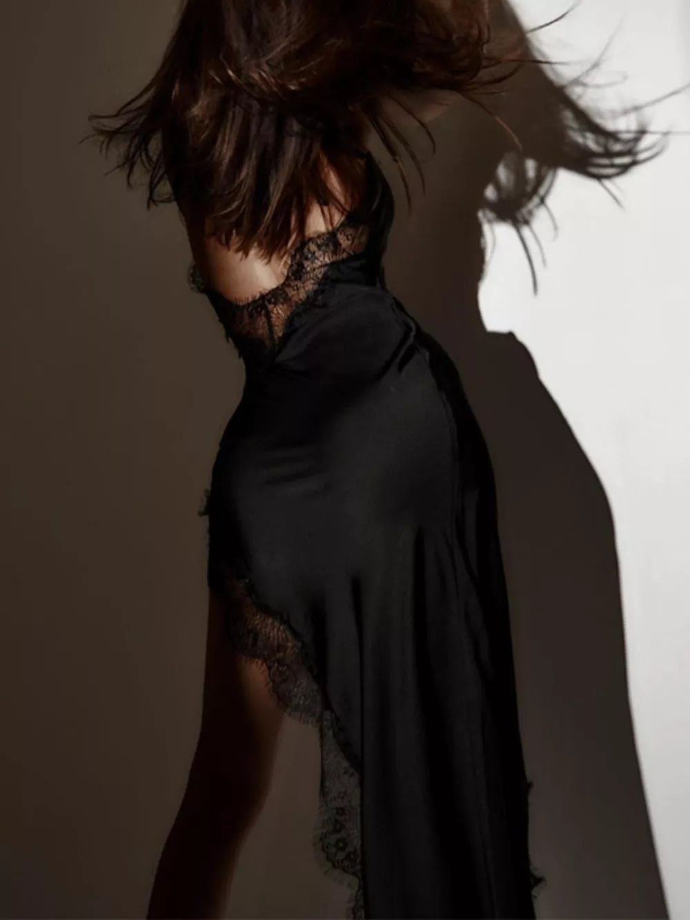 Black lace trim spaghetti strap midi dress with cowl neckline and open back detail.