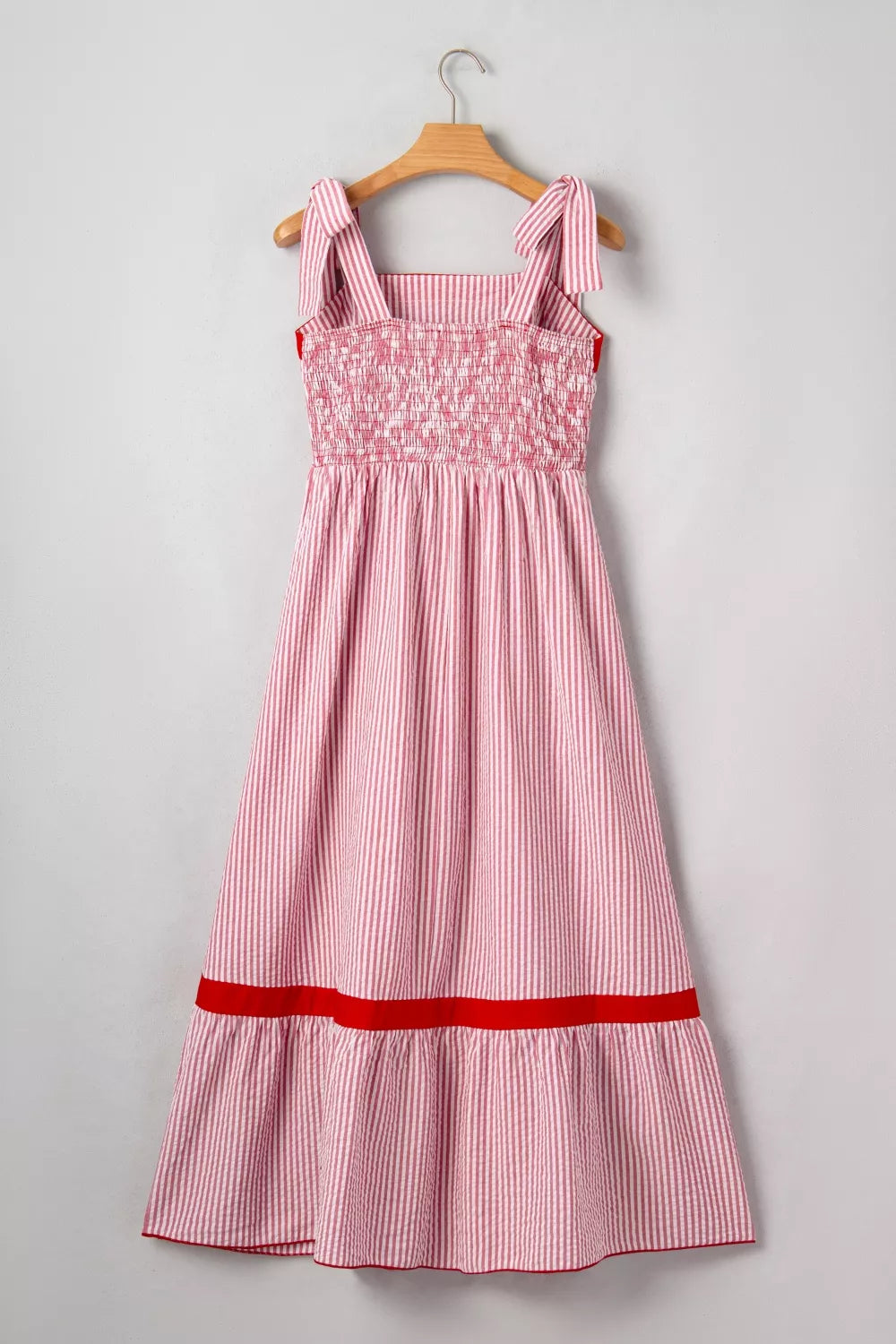 Red and white striped cotton maxi dress with smocked bodice and tie straps.