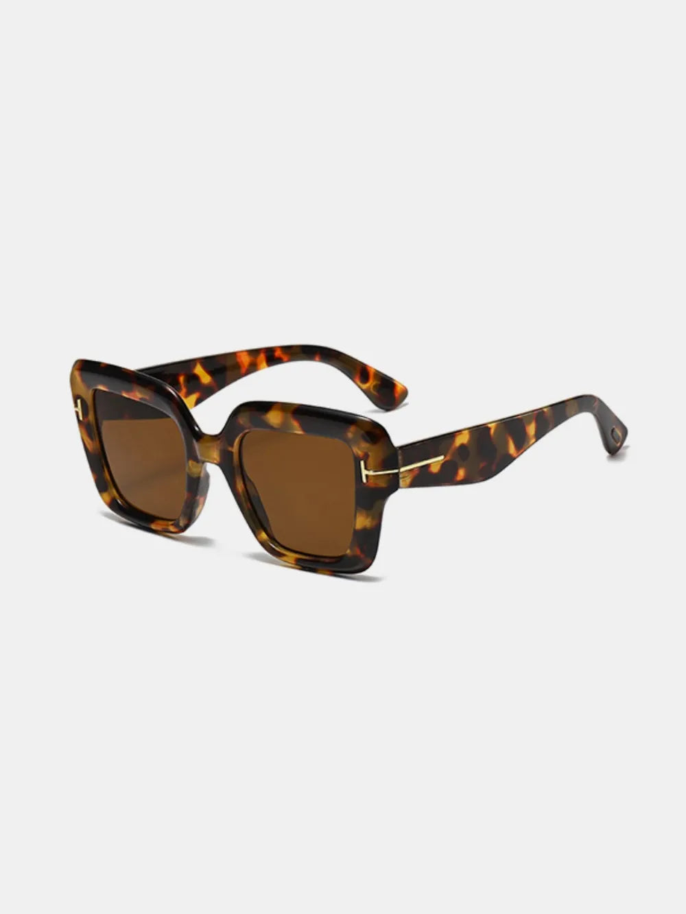 Geometric acetate sunglasses with brown tinted lenses and tortoise shell frames.