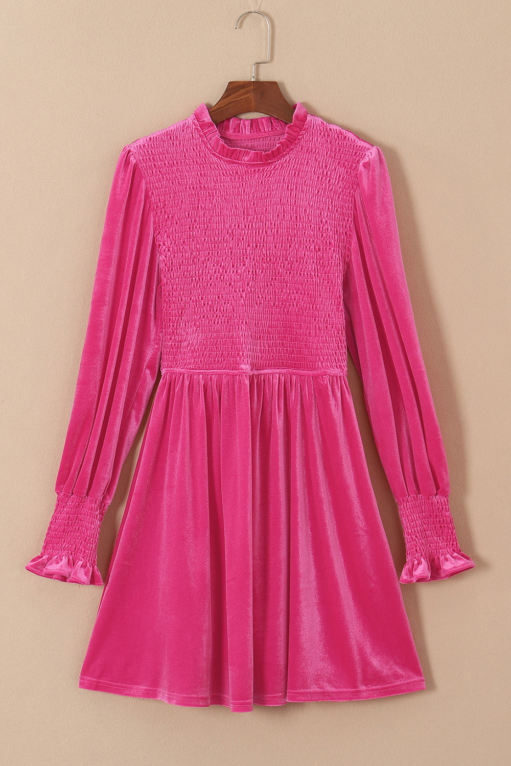 Hot pink velvet mini dress with smocked bodice, ruffled neckline, and smocked cuffs.