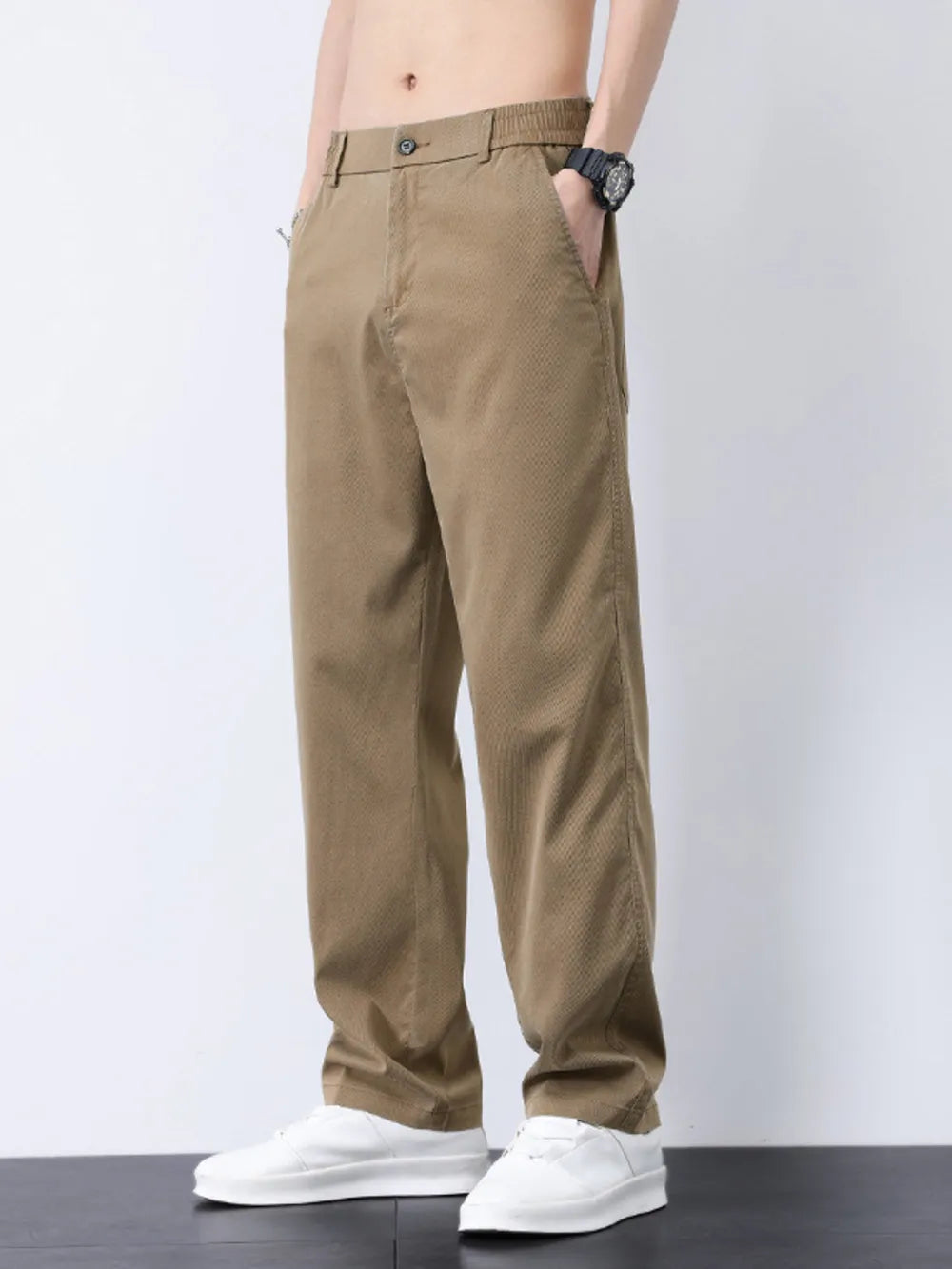 Relaxed fit camel cargo pants with a subtle textured pattern and elastic waistband.