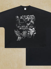 Black oversized graphic tee with gothic print and text.