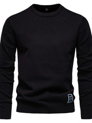 Black crew neck knit sweater with a small logo patch on the hem.