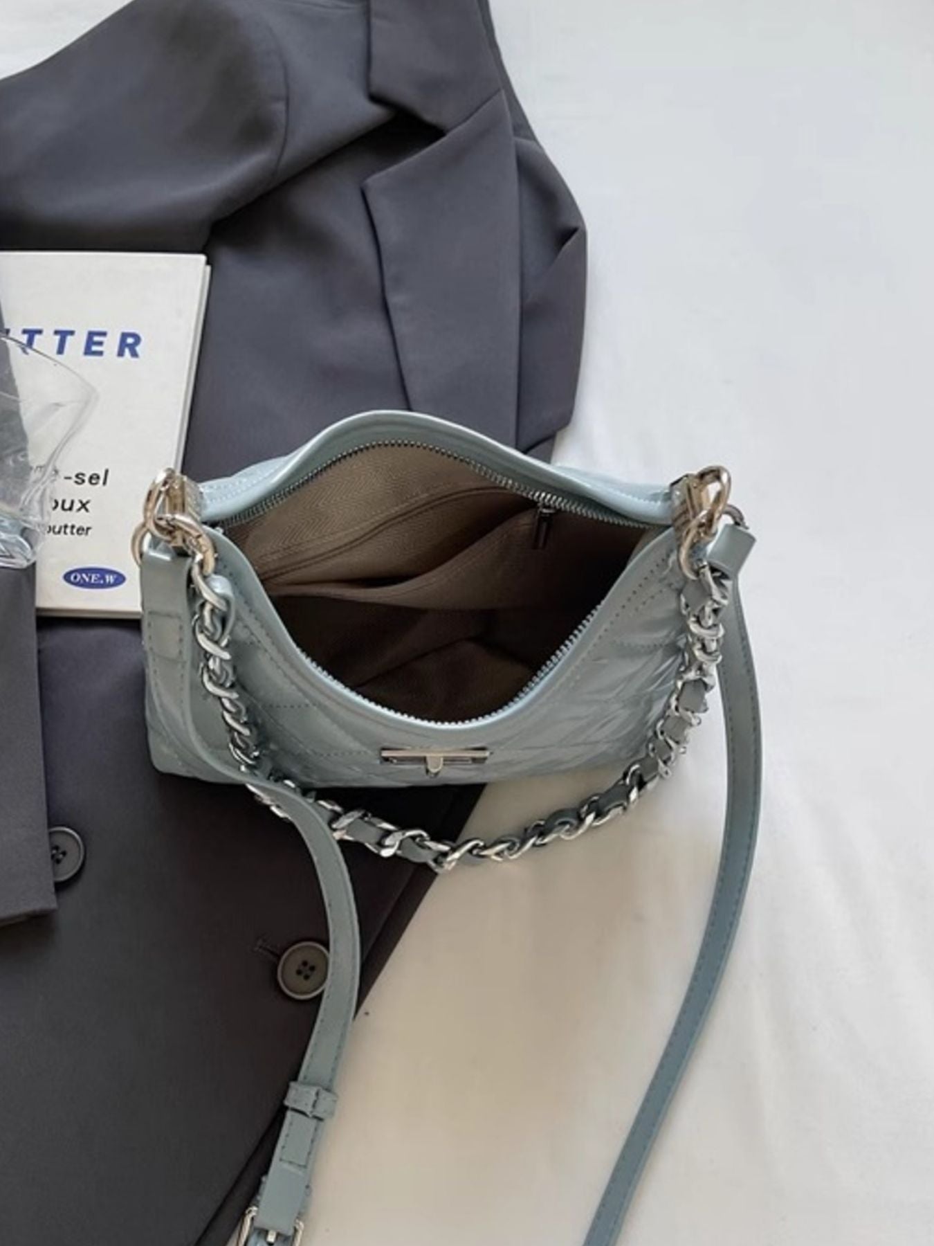 Blue quilted pu leather shoulder bag with silver chain strap detail