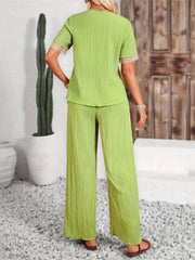 Lime crinkle knit v-neck top and wide leg pants set with embroidered trim.