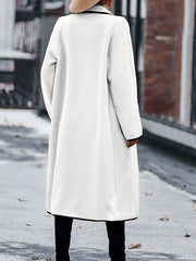 White teddy coat with black contrast trim detailing and a relaxed fit.