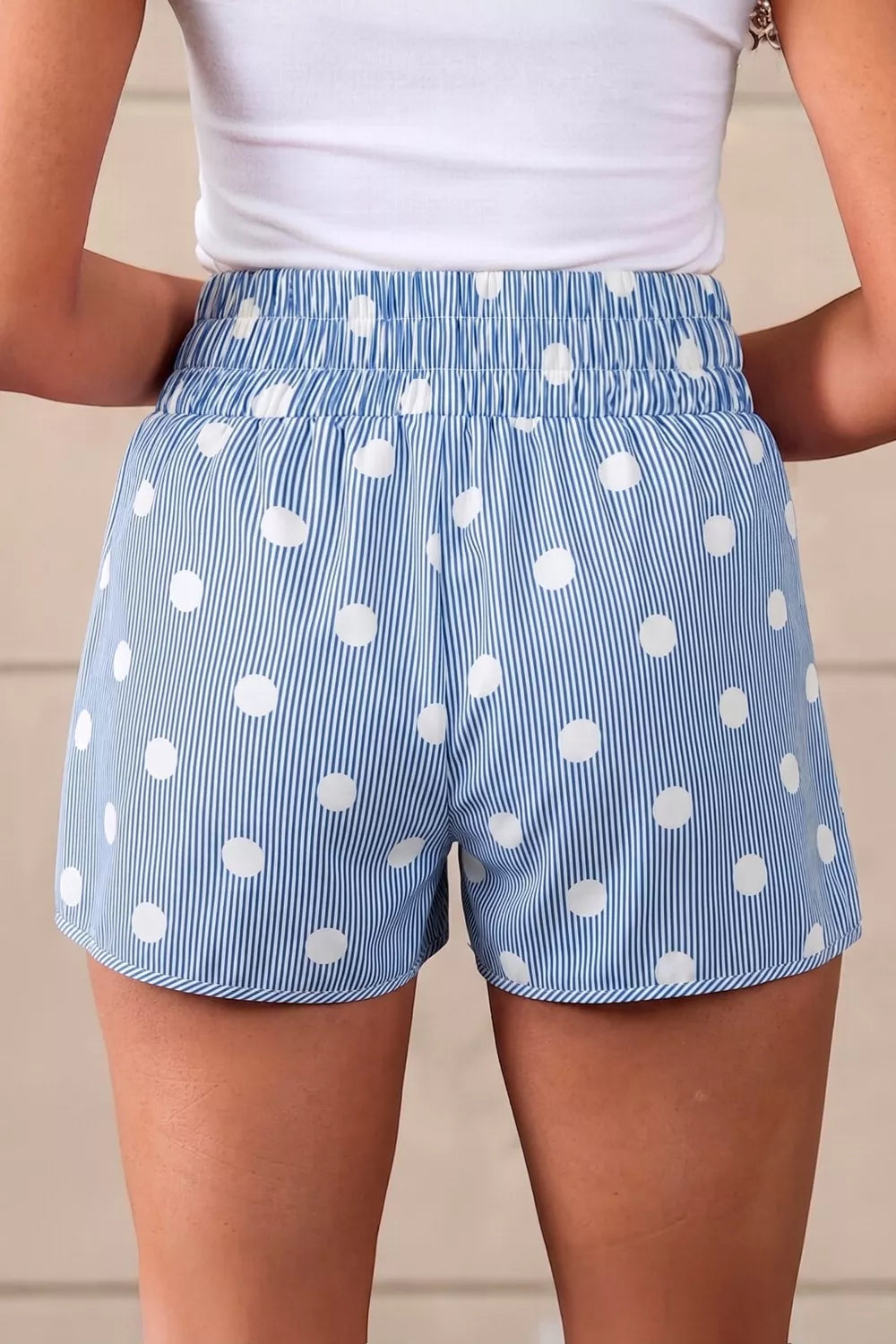 Blue and white striped polka dot shorts with elastic waist and pockets.