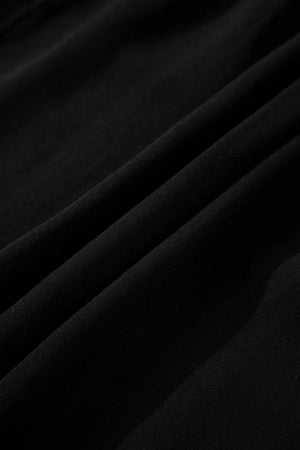 Black tiered maxi dress with hidden placket detail.