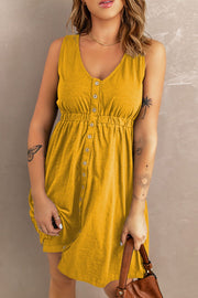 Yellow button-down mini dress with gathered waistline and V-neck.