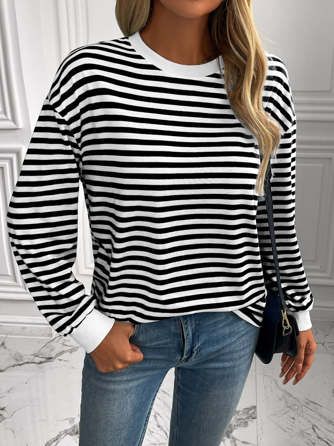 Horizontal stripe crewneck sweatshirt with white cuffs and crewneck.