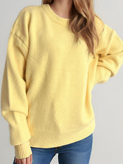 Yellow oversized crewneck knit pullover sweater with ribbed cuffs and hem.