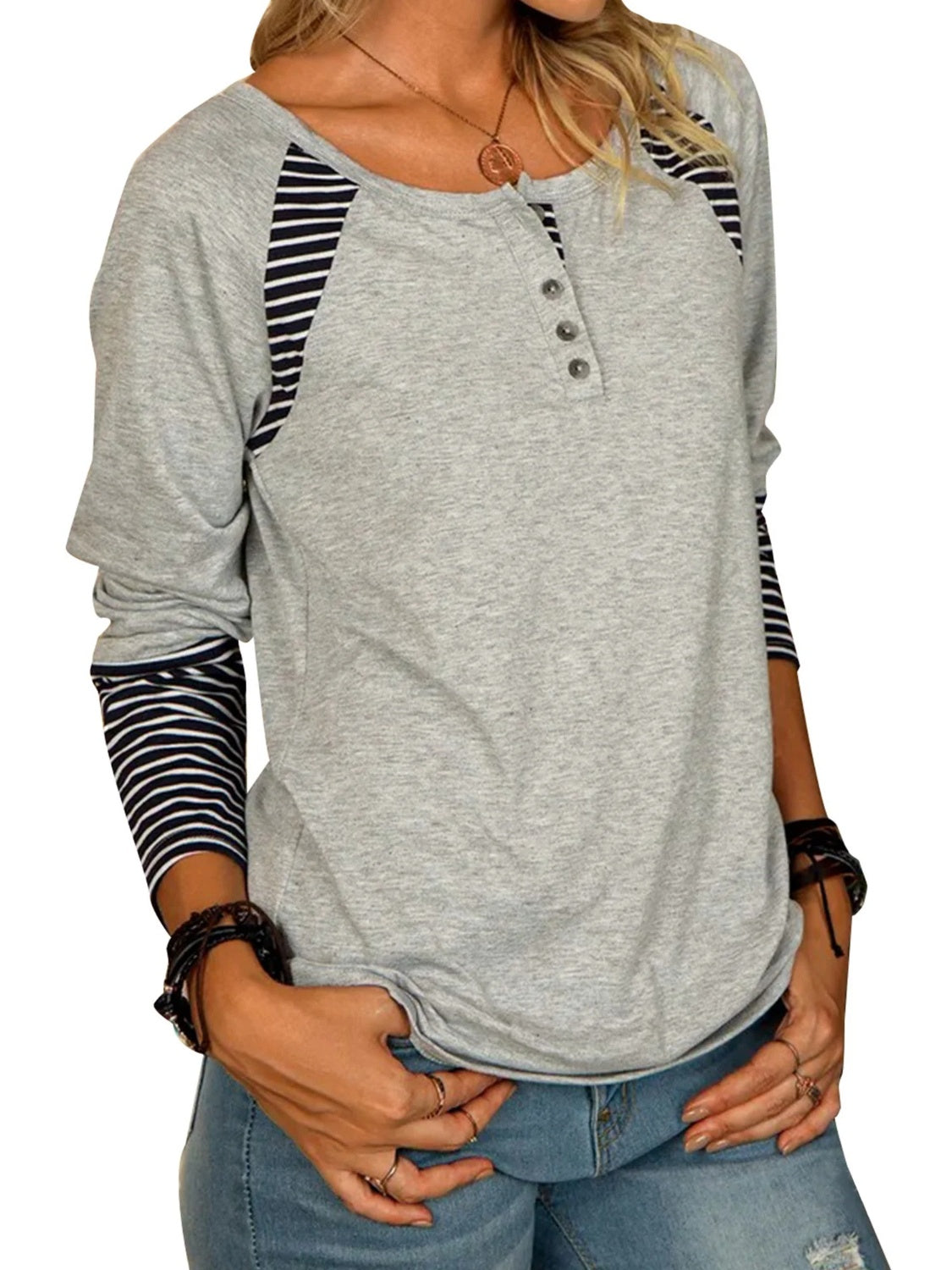 Gray raglan henley tee with button detail and striped long sleeves.